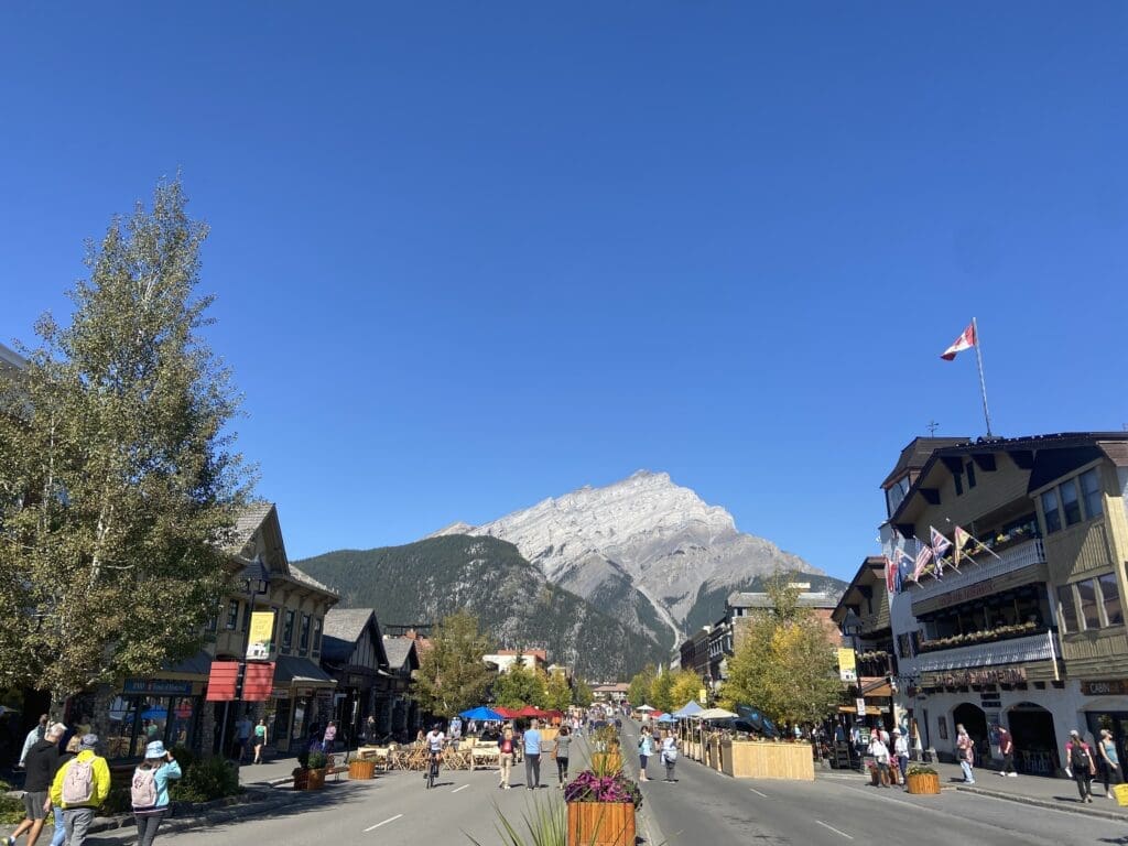 Banff Avenue in Banff National Park with not a single cloud in the sky