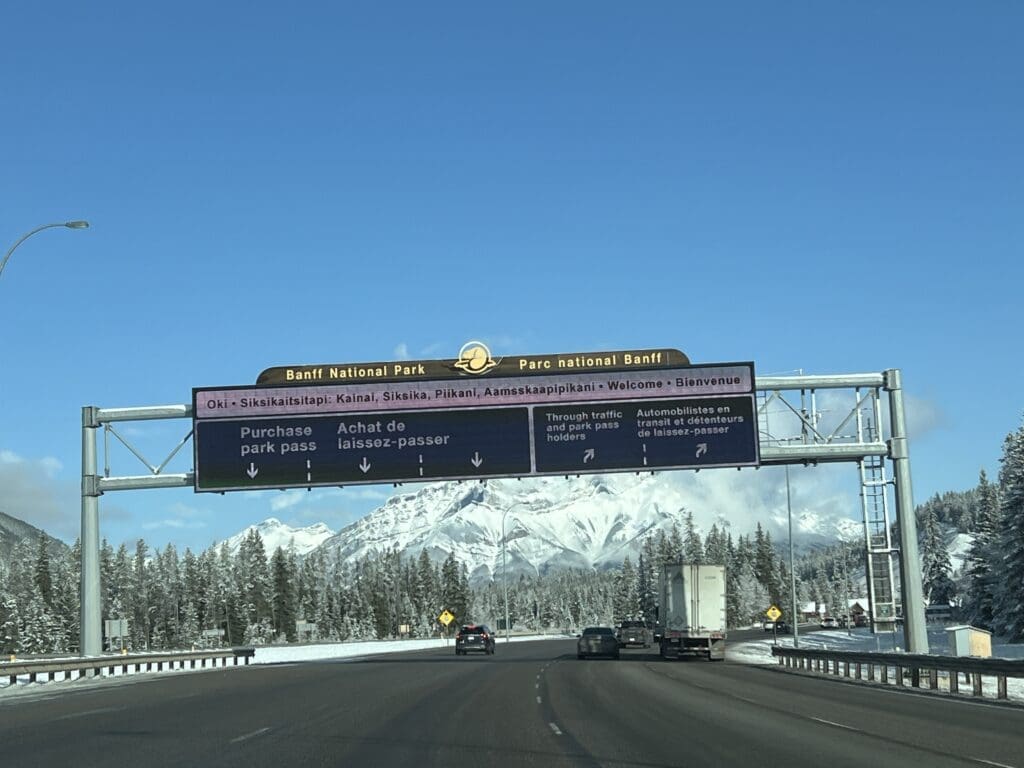 The left lane at the park gate in Banff National Park is to purchase park pass and the right lane are for park pass holder to pass the gate directly