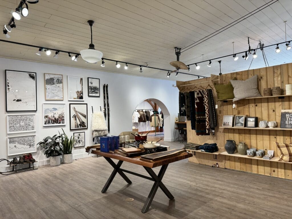 Interior of Stonewaters Home Elements in Canmore, Alberta, showcasing stylish home decor items including framed artwork, handcrafted pottery, rustic textiles, and modern furniture in a cozy boutique setting.