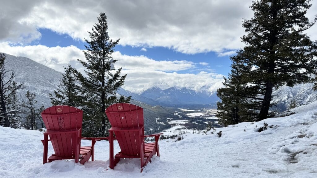 A pair of red chair placed by Parks Canada for being a scenic spot on Tunnel Mountain Summit in Banff National Park
