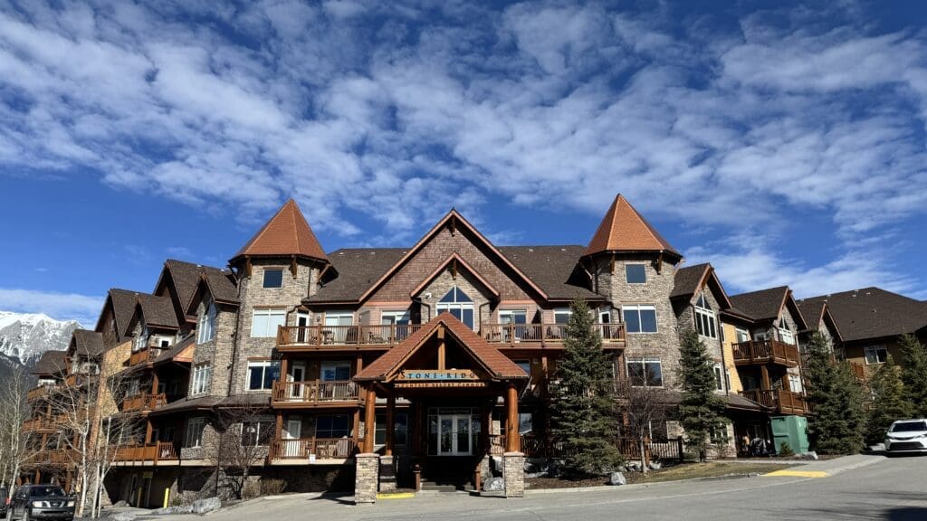 Stoneridge Mountain Resort in Canmore, Alberta with scenic mountain views and alpine-style architecture under a blue sky
