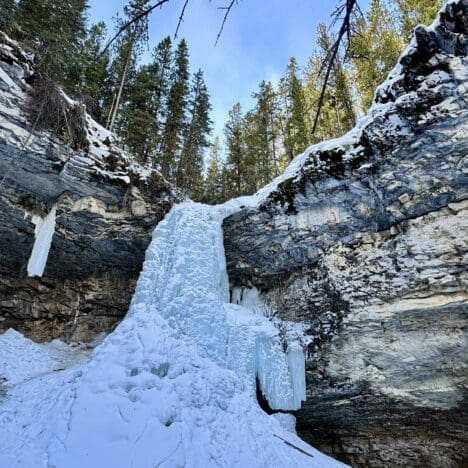 Frozen Troll Falls Kananaskis with a huge icefall in the middle of limestone